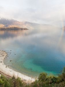 Preview wallpaper lake, mountains, coast, rainbow, after a rain