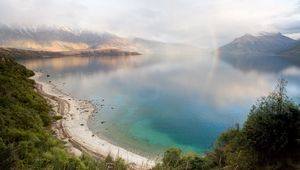 Preview wallpaper lake, mountains, coast, rainbow, after a rain