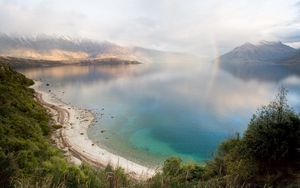 Preview wallpaper lake, mountains, coast, rainbow, after a rain