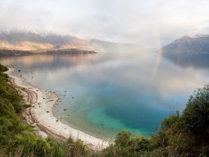 Preview wallpaper lake, mountains, coast, rainbow, after a rain