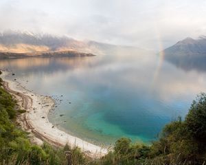 Preview wallpaper lake, mountains, coast, rainbow, after a rain