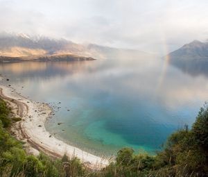 Preview wallpaper lake, mountains, coast, rainbow, after a rain