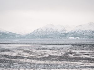 Preview wallpaper lake, mountains, frozen, ice, snow, winter