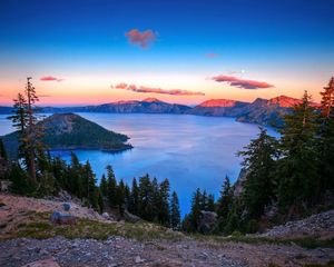 Preview wallpaper lake, mountains, height, island, trees, decline, clouds, sky, stony