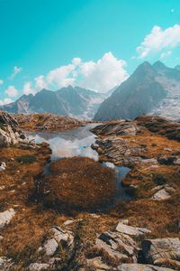 Preview wallpaper lake, mountains, herbs, stones, rocks, landscape