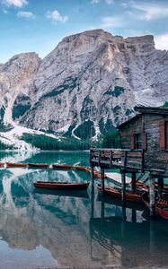 Preview wallpaper lake, mountains, house, boats, landscape, travel