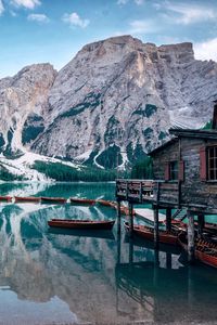 Preview wallpaper lake, mountains, house, boats, landscape, travel