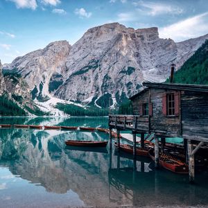 Preview wallpaper lake, mountains, house, boats, landscape, travel