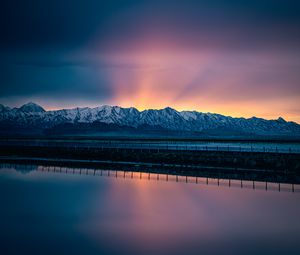 Preview wallpaper lake, mountains, road, dusk, sunset