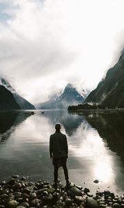 Preview wallpaper lake, mountains, rocks, man, loneliness