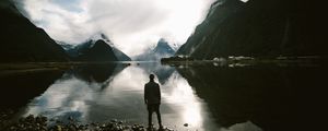 Preview wallpaper lake, mountains, rocks, man, loneliness