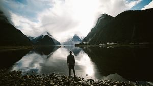 Preview wallpaper lake, mountains, rocks, man, loneliness