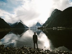 Preview wallpaper lake, mountains, rocks, man, loneliness