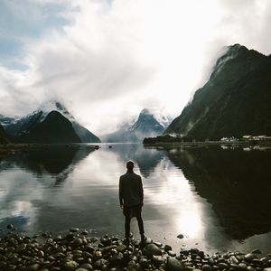 Preview wallpaper lake, mountains, rocks, man, loneliness