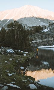 Preview wallpaper lake, mountains, shore, man, camping, nature