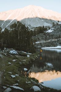 Preview wallpaper lake, mountains, shore, man, camping, nature