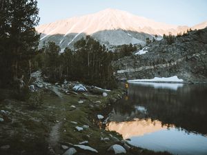 Preview wallpaper lake, mountains, shore, man, camping, nature