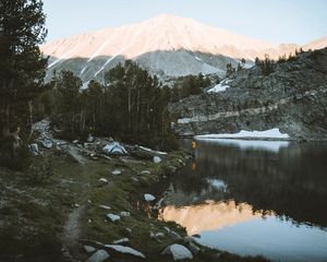 Preview wallpaper lake, mountains, shore, man, camping, nature