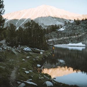 Preview wallpaper lake, mountains, shore, man, camping, nature