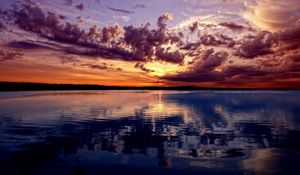 Preview wallpaper lake, mountains, sky, evening, reflection, ripples, surface of the water, colors