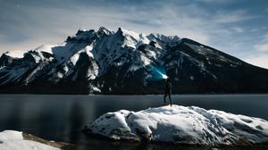 Preview wallpaper lake, mountains, snow, man, night