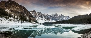 Preview wallpaper lake, mountains, stones, snow, clouds
