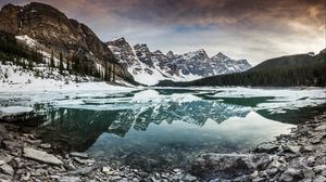 Preview wallpaper lake, mountains, stones, snow, clouds
