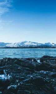 Preview wallpaper lake, mountains, stones, ice, snow, winter, landscape, sky