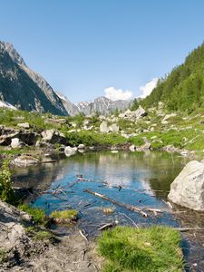 Preview wallpaper lake, mountains, stones, rocks, valley, landscape