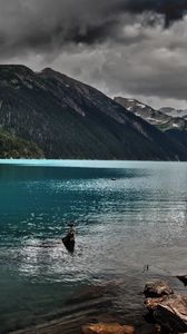 Preview wallpaper lake, mountains, stones, cloudy, despondency