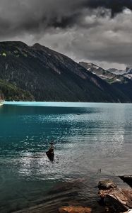 Preview wallpaper lake, mountains, stones, cloudy, despondency