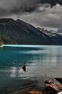 Preview wallpaper lake, mountains, stones, cloudy, despondency