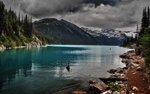 Preview wallpaper lake, mountains, stones, cloudy, despondency