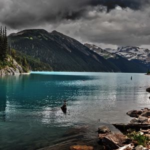 Preview wallpaper lake, mountains, stones, cloudy, despondency