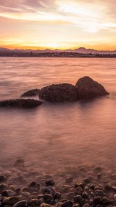 Preview wallpaper lake, pebbles, stones, hills, sunrise