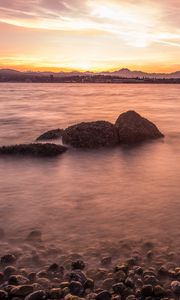 Preview wallpaper lake, pebbles, stones, hills, sunrise