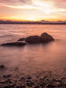 Preview wallpaper lake, pebbles, stones, hills, sunrise