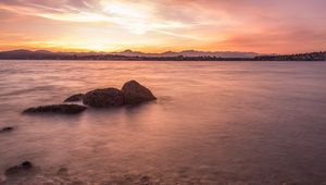 Preview wallpaper lake, pebbles, stones, hills, sunrise