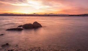 Preview wallpaper lake, pebbles, stones, hills, sunrise