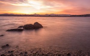 Preview wallpaper lake, pebbles, stones, hills, sunrise