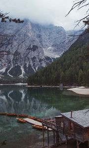 Preview wallpaper lake, pier, boats, mountain, trees, shore