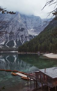 Preview wallpaper lake, pier, boats, mountain, trees, shore