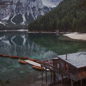 Preview wallpaper lake, pier, boats, mountain, trees, shore