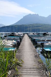 Preview wallpaper lake, pier, boats, mountains, fog, clouds