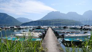 Preview wallpaper lake, pier, boats, mountains, fog, clouds