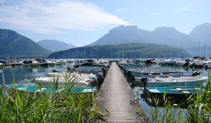 Preview wallpaper lake, pier, boats, mountains, fog, clouds