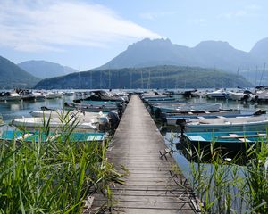 Preview wallpaper lake, pier, boats, mountains, fog, clouds