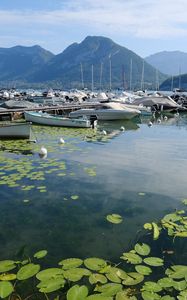 Preview wallpaper lake, pier, boats, mountains, water lilies, nature