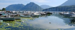 Preview wallpaper lake, pier, boats, mountains, water lilies, nature