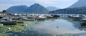 Preview wallpaper lake, pier, boats, mountains, water lilies, nature